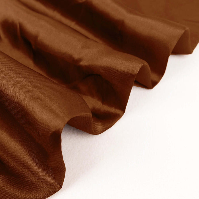 Brown satin fabric draped elegantly on a surface.