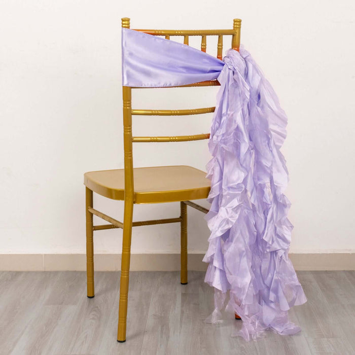 Lavender ruffled chair sash draped on a gold chair.