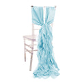 Light blue ruffled chair sash draped on a clear chiavari chair