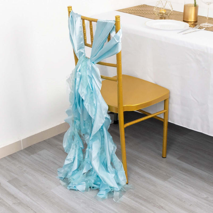 Light blue chair sash tied on a gold chair at a dining table.
