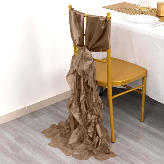 Elegant gold chair sash draped for event decor.