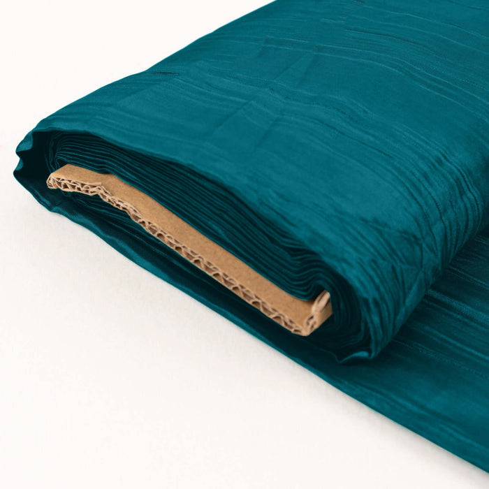 Teal fabric roll with textured finish on a white background