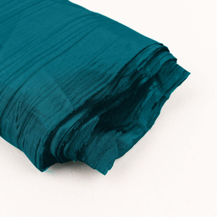 Teal textured fabric roll on a plain background