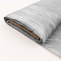 Silver textured fabric roll on a plain background.