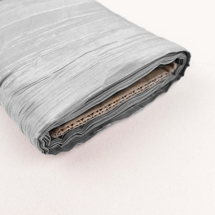 Gray fabric roll with textured finish on a neutral background.