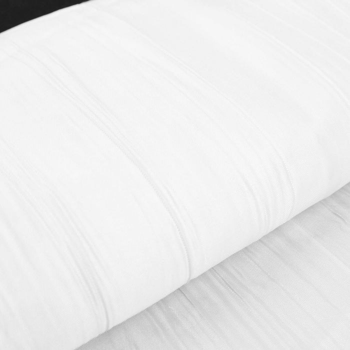 White textured fabric roll on a black background.