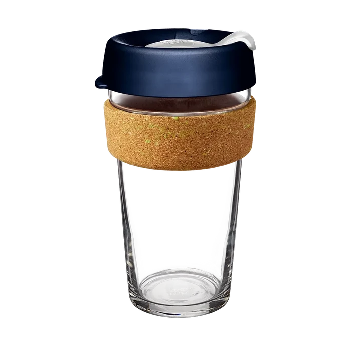 KeepCup Brew Cork in Ace, 16oz size, featuring a clear glass cup with a natural cork band and navy blue lid with a white sip-through plug, shown on a plain white background.