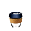 KeepCup Brew Cork in Spruce, small 8oz size, shown against a white background. The reusable cup features a clear glass body, natural cork band, and deep navy blue lid with a plastic sipper plug.