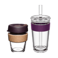 KeepCup Booked & Busy Alder set featuring two reusable cups: a smaller glass KeepCup with cork band and dark plum lid, alongside a larger clear double-walled tumbler with purple silicone band, clear lid and straw, shown on a white background.