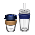 KeepCup Booked & Busy bundle in Ink colour featuring two reusable cups: a glass cup with cork band and navy blue lid on the left, and a clear double-walled LongPlay tumbler with navy silicone band and straw on the right, shown against a white background.