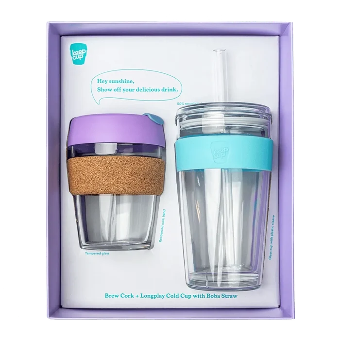 KeepCup Booked & Busy Moonlight gift set in lavender packaging, featuring a Brew Cork cup with tempered glass, purple lid and recovered cork band alongside a Longplay Cold Cup with aqua silicone sleeve and boba straw.
