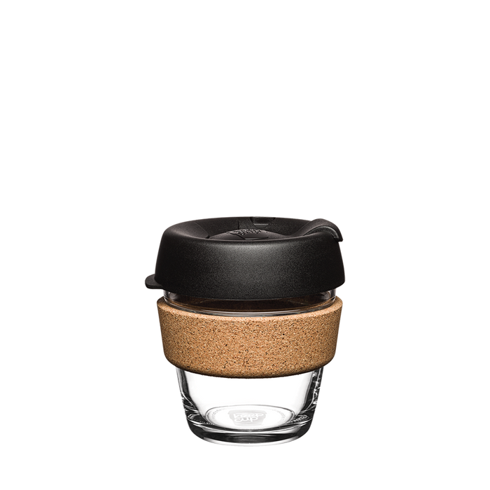 KeepCup Brew Cork XS 6oz in Black, featuring a clear glass cup with natural cork band and black lid with sipper closure, shown against a white background.