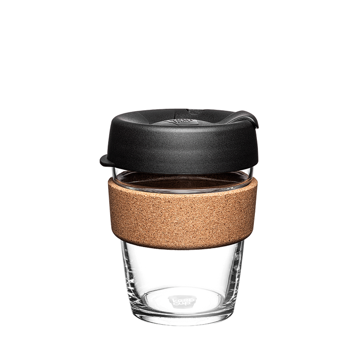 KeepCup Brew Cork M 12oz in Black, featuring a clear tempered glass cup with natural cork band and black press-fit lid with sipper, photographed front-on against a white background.