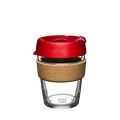 KeepCup Brew Cork M 12oz in Dawnbreak, featuring a clear tempered glass cup with natural cork band and red lid with sipper opening, shown from a straight-on angle against a white background.