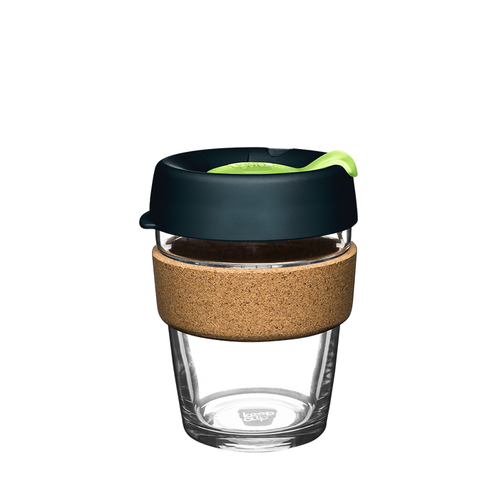 KeepCup Brew Cork M 12oz in Deep, featuring a clear glass cup with natural cork band, dark charcoal lid and bright green plug, shown against a white background.
