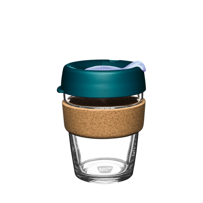 KeepCup Brew Cork M 12oz in Eventide, featuring a clear tempered glass cup with natural cork band and deep teal lid with light-coloured plug, shown from a front angle against a white background.