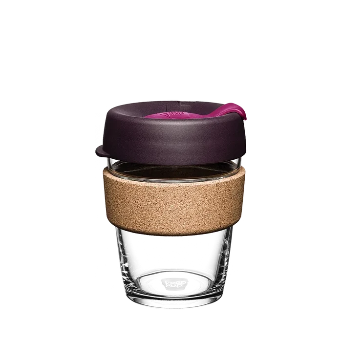 KeepCup Brew Cork M 12oz in Nutmeg, featuring a clear tempered glass cup with natural cork band and dark plum-coloured lid with pink sipper plug, shown against a plain white background.