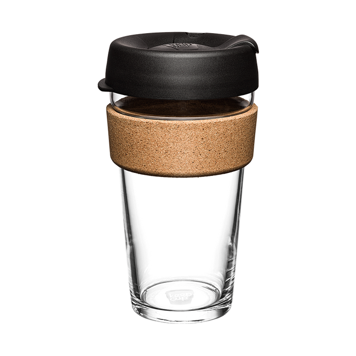 KeepCup Brew Cork L 16oz in Black, shown from a front angle against a white background, featuring a clear tempered glass cup, natural cork band, and black plastic lid with sipper opening.
