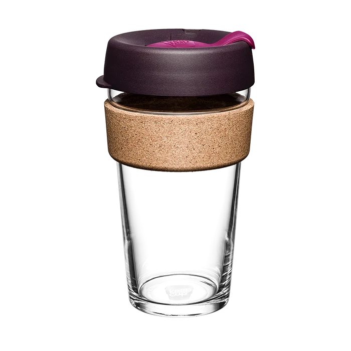KeepCup Brew Cork L 16oz in Nutmeg, featuring a clear tempered glass cup with natural cork band, dark purple lid and pink plug, shown against a white background in a straight-on product shot.
