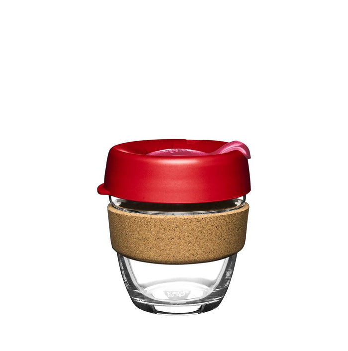 KeepCup Brew Cork S 8oz in Daybreak, featuring a clear tempered glass cup with natural cork band and red silicone lid with sip hole, shown against a white background.