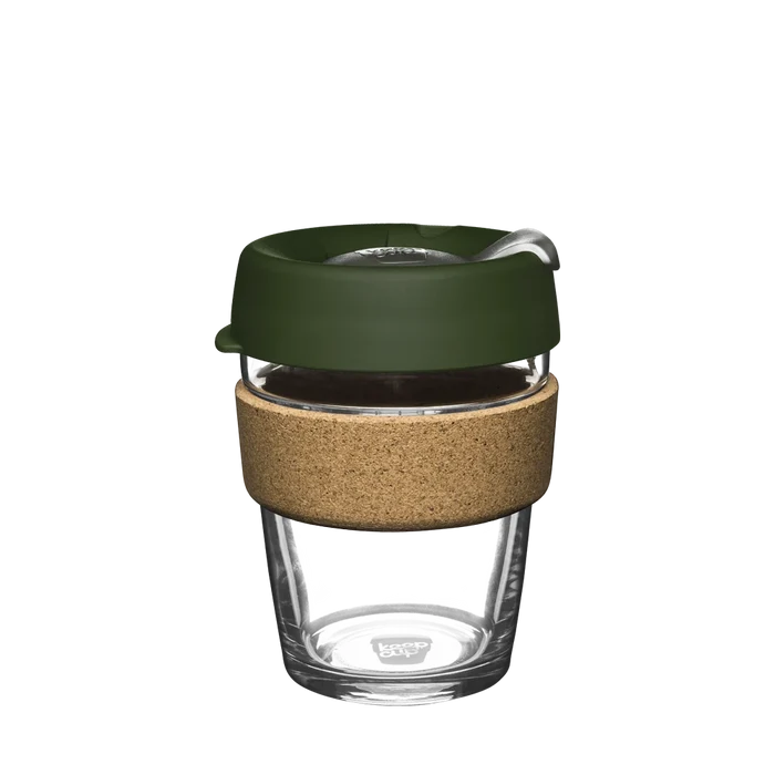 KeepCup Brew Cork M 12oz in Pine, featuring a clear glass cup with natural cork band and olive green lid with sipper spout, shown against a white background.