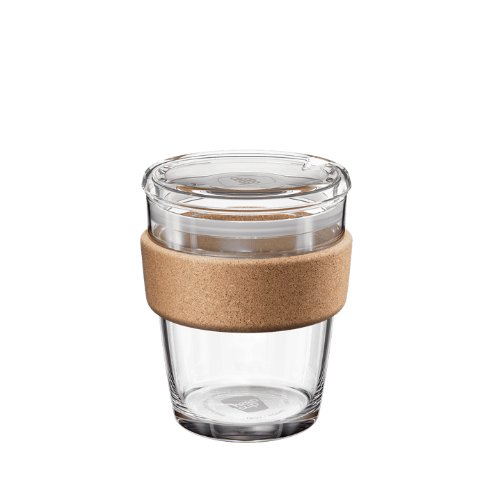 Brew Cork Quicksip M 12oz reusable glass coffee cup with natural cork band and clear plastic lid, shown at a slight angle against a white background.