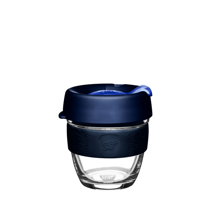 KeepCup Brew S 8oz in Ink colour, featuring a clear glass cup with navy blue silicone band and dark blue lid with matching plug, shown against a white background.