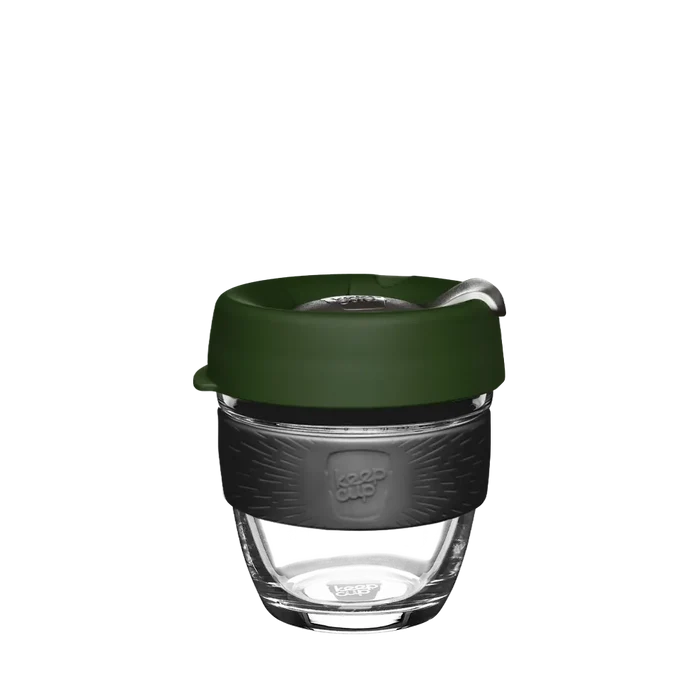 KeepCup Brew S 8oz in Pine, featuring a clear glass cup with dark charcoal silicone band and deep green lid, shown against a white background.