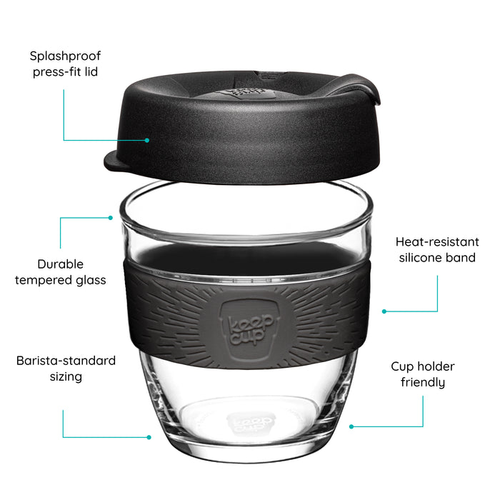 KeepCup reusable glass cup with a black lid and black band on a white background that features text