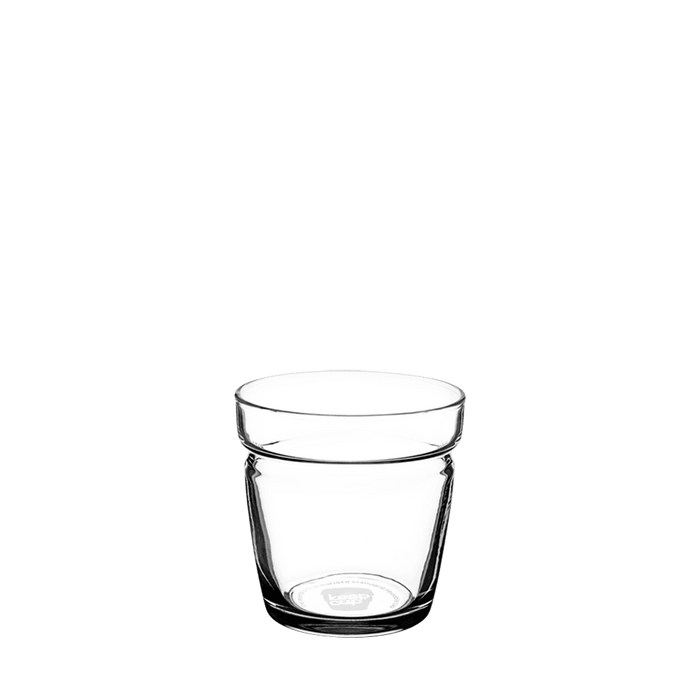 Brew Glass Base XS 6oz in clear glass, shown at a slight angle against a white background, featuring the KeepCup logo embossed on the base and a distinctive tapered shape with a subtle rim detail near the top.