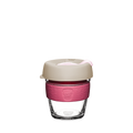 KeepCup Brew XS 6oz in Primrose, featuring a clear tempered glass cup with a dusty pink silicone band and beige lid with light pink plug, shown against a white background.