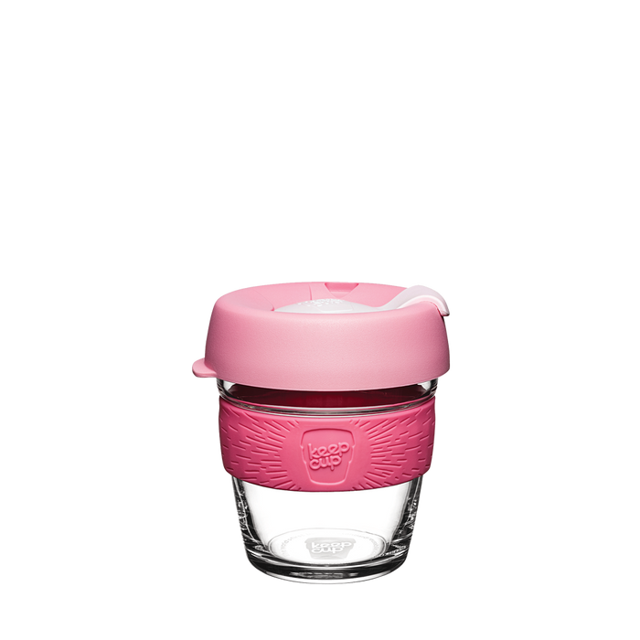 KeepCup Brew XS 6oz in Saskatoon, featuring a clear glass cup with a pink silicone band and matching pink lid with a white plug, shown against a plain white background.