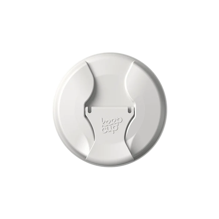 Top-down view of the KeepCup Commuter Flip Lid in Bone, showing the circular off-white lid with its distinctive curved drinking spout and embossed KeepCup logo in the centre.