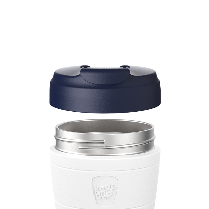 Navy Commuter Flip Lid hovering above a white KeepCup thermal cup with stainless steel rim, shown in an exploded view to display how the lid attaches to the cup.