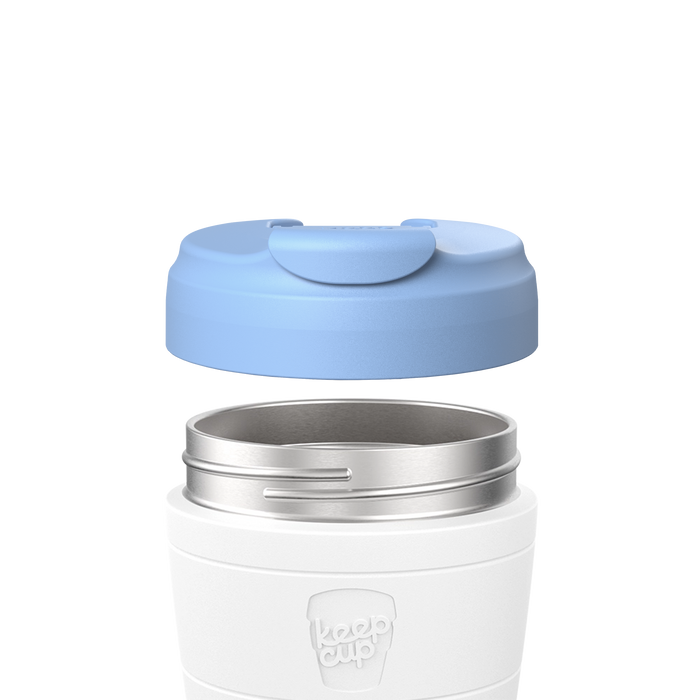 Exploded view showing the Commuter Flip Lid in Orchid blue hovering above a white KeepCup with stainless steel rim, demonstrating how the lid attaches to the reusable cup.