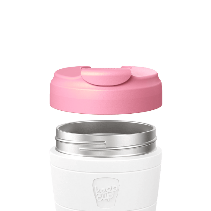 KeepCup Commuter Flip Lid in Peony pink shown hovering above a white reusable cup with stainless steel rim, demonstrating how the lid attaches to the cup in an exploded product view.