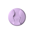 Top-down view of the KeepCup Commuter Flip Lid in Wisteria, a soft lavender colour, showing the closed sipper mechanism with embossed KeepCup logo in the centre.