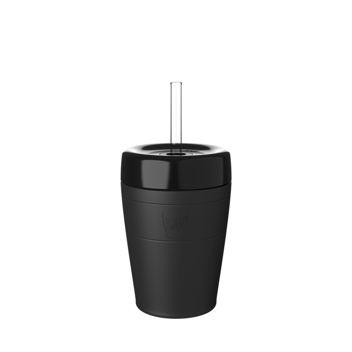 KeepCup Commuter Cold Cup M 12oz in Black, shown against a white background with a clear straw inserted through the glossy black lid, featuring the embossed KeepCup logo on the matte black cup body.