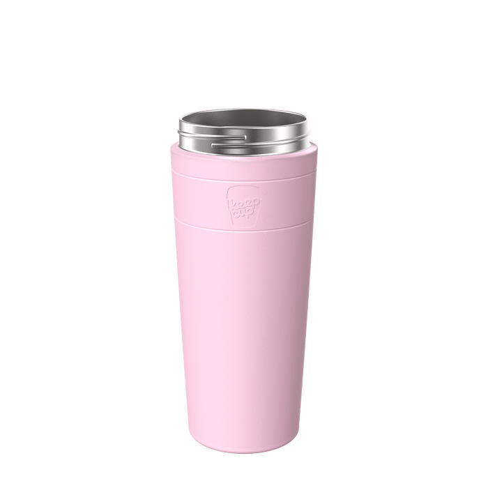 KeepCup Helix Stainless Steel Base XL 20oz in Pashmak Pink, shown at a slight angle against a white background, featuring the embossed KeepCup logo on the soft pink sleeve and stainless steel rim at the top.