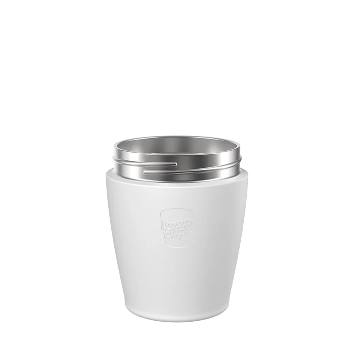 KeepCup Helix Stainless Steel Base in White, S 8oz size, shown from a front angle against a plain white background, featuring the embossed KeepCup logo and silver stainless steel rim threading visible at the top.