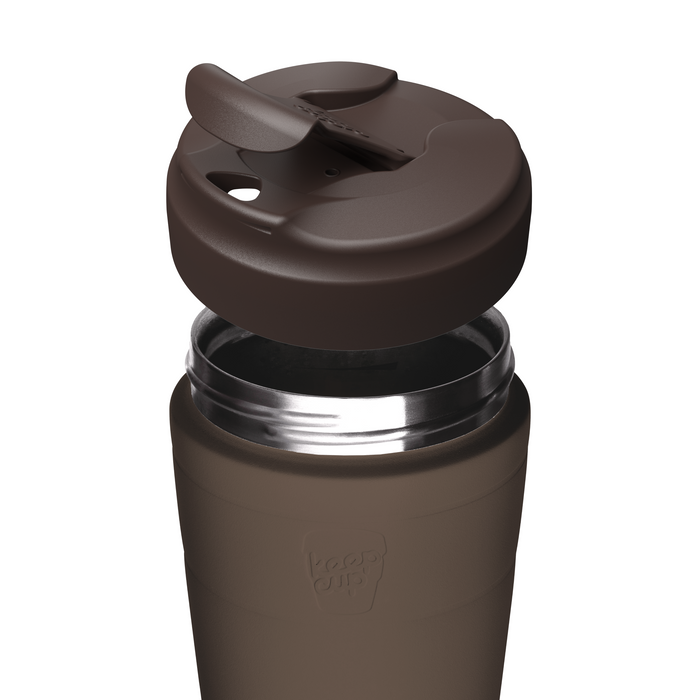 A close-up of a dark brown insulated KeepCup travel tumbler with a matching dark brown flip-top lid, shown on a plain white background. The brand name 'KeepCup' is embossed on the lower front of the tumbler.