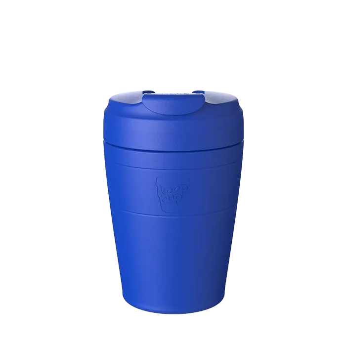 KeepCup Commuter M 12oz in Electric Blue, shown in a front-facing product shot against a white background, featuring the embossed KeepCup logo and flip-top lid.