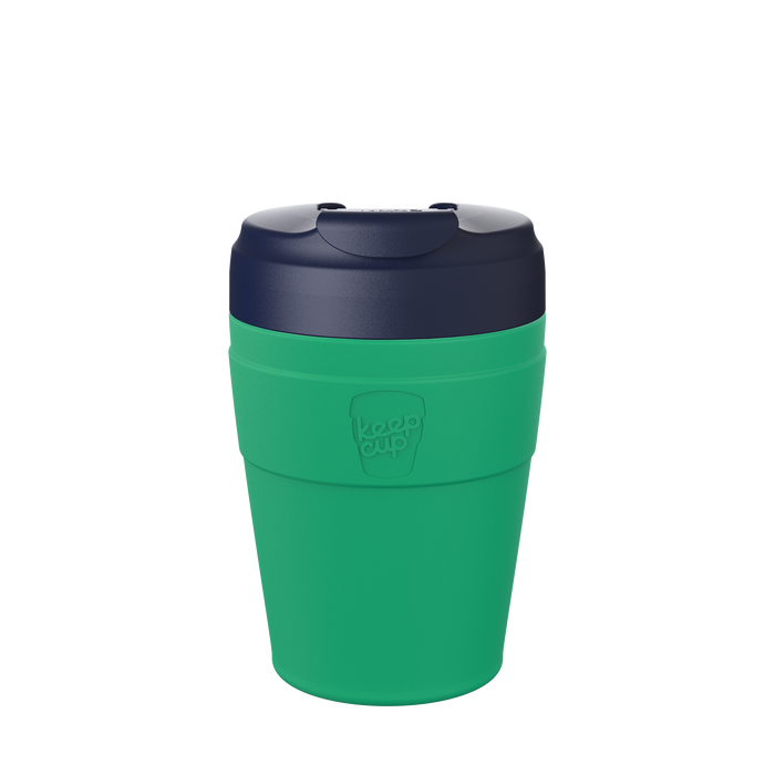 KeepCup Commuter M 12oz in Emerald Ink, featuring a green reusable cup body and dark navy lid, shown against a plain white background.