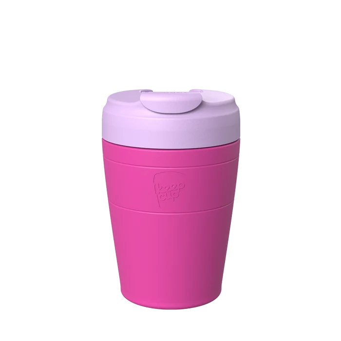 KeepCup Commuter M 12oz in Fuchsia Lilac, featuring a bright pink body with light lilac lid and sipper closure, shown against a plain white background.