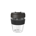 KeepCup Commuter Light M 12oz in Black, shown against a white background. The reusable cup features a clear lightweight plastic body, dark charcoal lid with sipper spout, and matching black silicone band with embossed KeepCup logo.