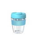 KeepCup Commuter Light M 12oz in Cloud colour, featuring a clear lightweight plastic cup with light blue silicone band and matching lid with sipper closure, shown against a white background.