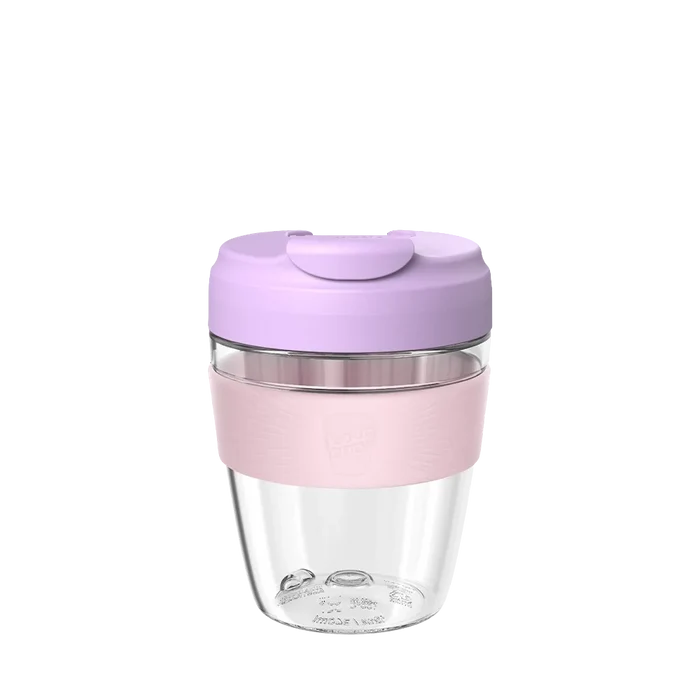 KeepCup Commuter Light M 12oz in Lilac, featuring a clear glass cup with soft pink silicone band and lavender-coloured lid with sipper closure, shown against a white background.