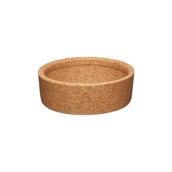 Cork Band for KeepCup Glass XS, shown from a slight angle against a white background, displaying the natural cork material's speckled tan texture and shallow cylindrical shape.