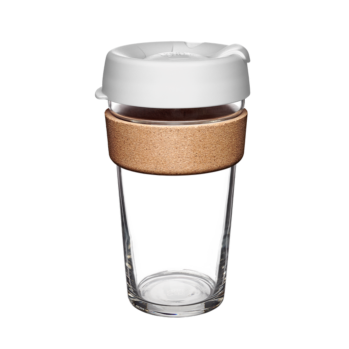 Design Your Own Brew Cork L 16oz reusable coffee cup photographed against a white background, featuring a clear tempered glass body, natural cork band for heat protection, and white silicone lid with a closable drinking spout.