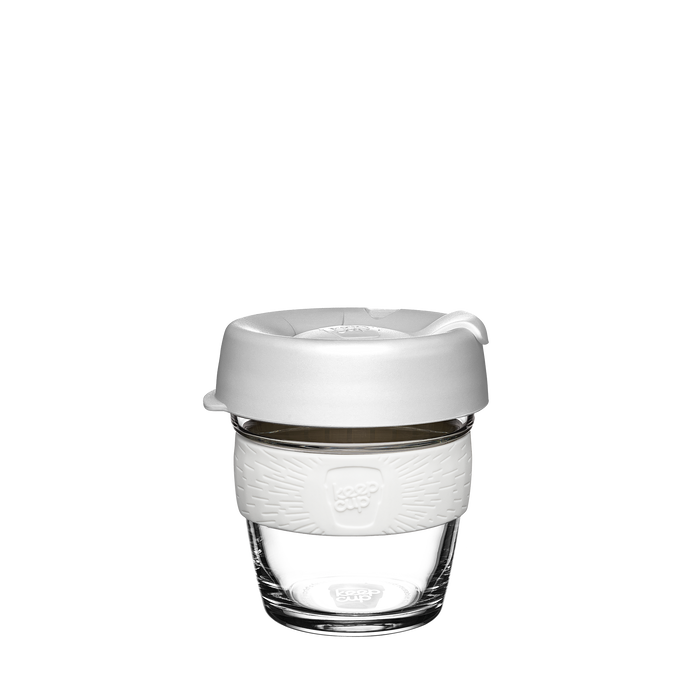 KeepCup Brew XS 6oz reusable glass coffee cup in a custom design featuring a clear glass base, white silicone band with KeepCup logo, and white plastic lid with sipper, shown against a plain white background.